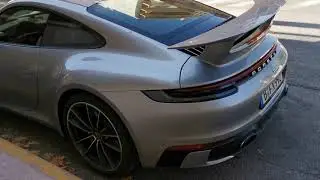 silver porsche 992 carrera 4s with a huge rear wing in antibes France