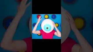 a clown dropped a giant eyeball on a girl's head.