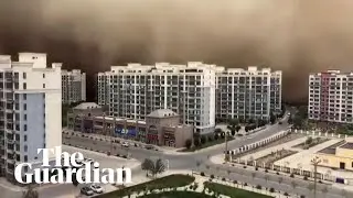 Dramatic moment sandstorm swallowing Chinese city Dunhuang