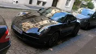 2020 black porsche 911 992 carrera 4S in paris France