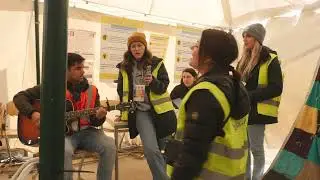 Romanian-Ukrainian border. Volunteers singing a 