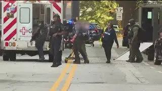 APD officer hurt, suspect in custody | Latest on shooting in Midtown Atlanta