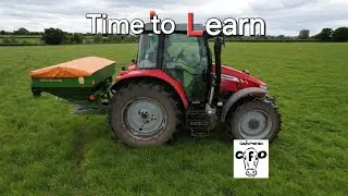 Learning how to spread fertiliser on grassland.